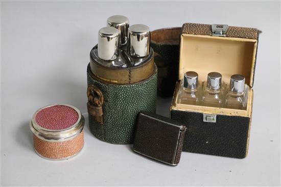 A modern Asprey & Co silver and shagreen box, two shagreen cased travelling flask sets and a shagreen cased tape measure.